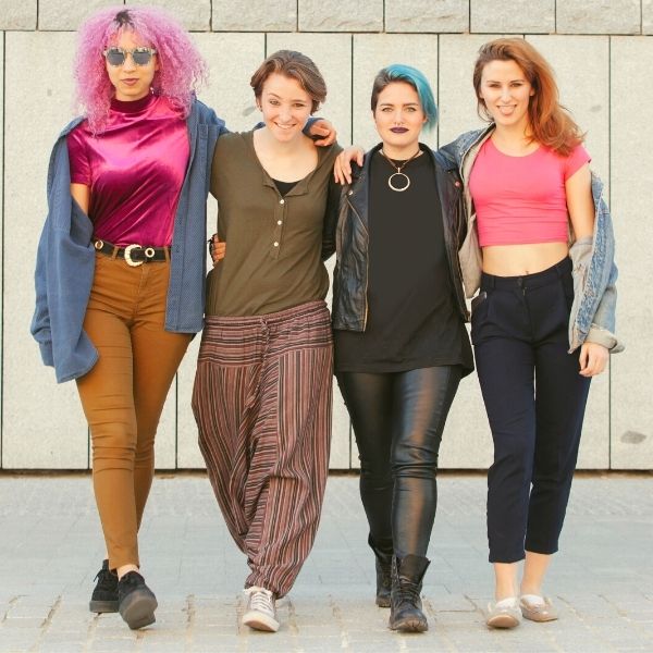 Teen Group of Women Hugging and Walking on the Street